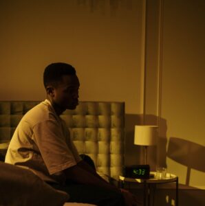 A man experiencing insomnia seeking mental health support in New York from Dr. Merlyn Clarke INC.